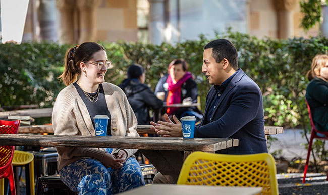 Anna Merlo and Dony Rodriguez chatting at Merlo cafe.