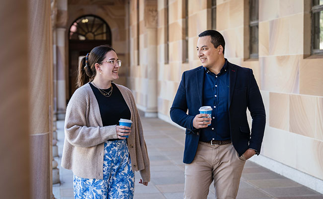 Anna and Dony walking in the Great Court with coffee.