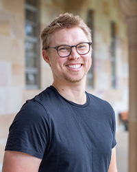Profile photo of Dr Dylan Lino in UQ's Great Court