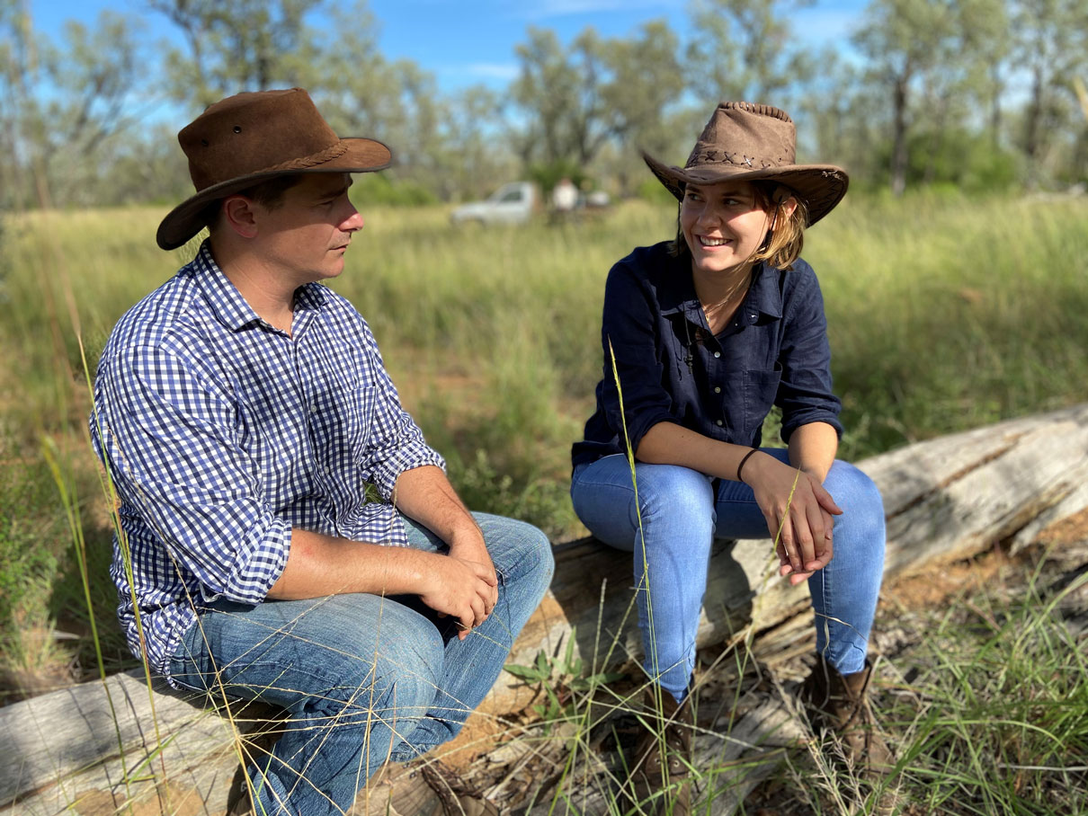 This is an image of Briana Collins with EDO principal solicitor Sean Ryan in the footprint of the proposed Galilee Coal Project mine