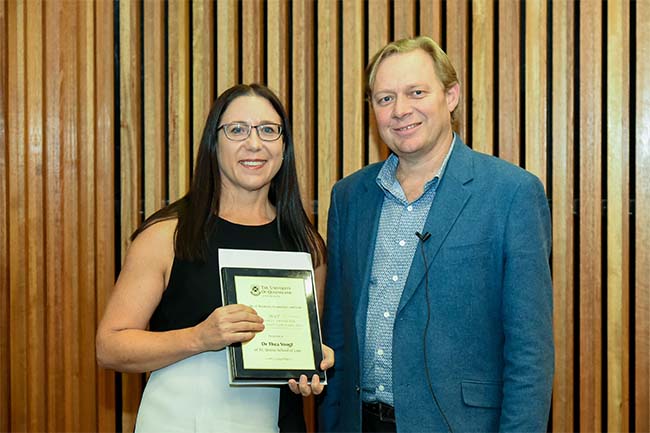 Dr Thea Voogt receiving the Teaching Excellence award from Andrew Griffiths