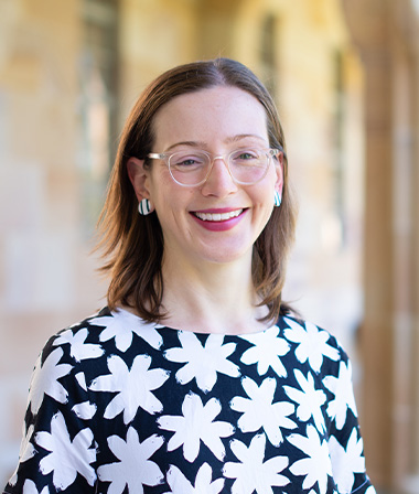 Profile photo of Dr Kate Falconer standing in UQ's Great Court