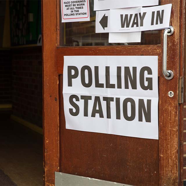 Signage on the door of a polling station.