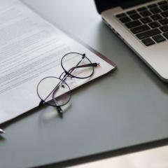 Contract, glasses and laptop