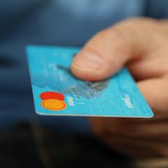 Person holding credit card