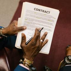 two men going over a contract