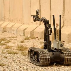US navy robot, Talon, moves towards a mock IED