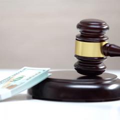 law gavel and a bundle of money
