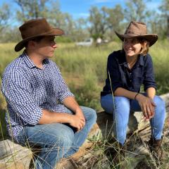 This is an image of Briana Collins with EDO principal solicitor Sean Ryan in the footprint of the proposed Galilee Coal Project mine