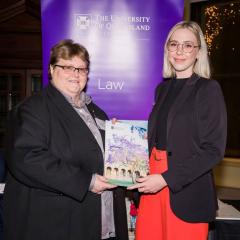 Grace Vipen accepting her law award from Terri Mottershead