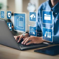 Man transferring secure files on a laptop 