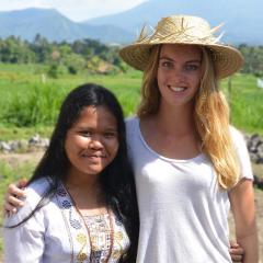 UQ student standing in a field in Bali