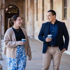 Anna and Dony walking in the Great Court with coffee.