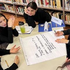 students around a table at the Transnational Organised Crime program in Ferrara, Italy