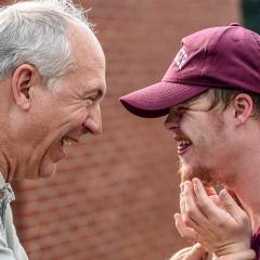 Two men laughing