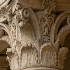 ornately carved top of sandstone column