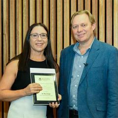 Dr Thea Voogt receiving the Teaching Excellence award from Andrew Griffiths