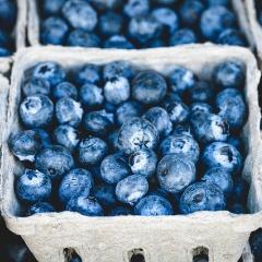 This is an image of several cartons of blueberries