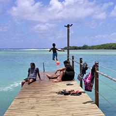 South Pacific islander family on jetty 
