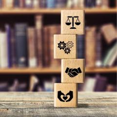 Set of wooden cubes with legal icons on them